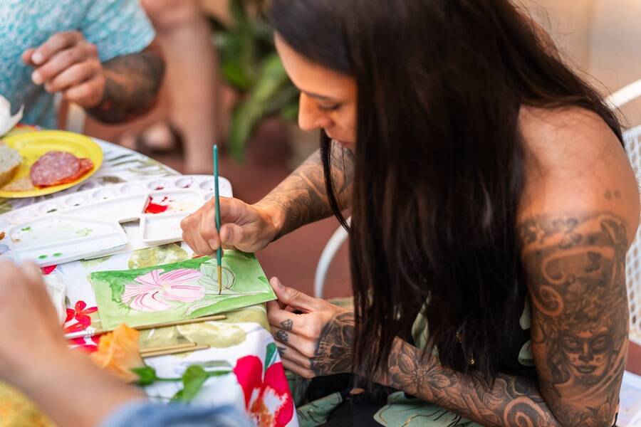 adult working on watercolor class painting